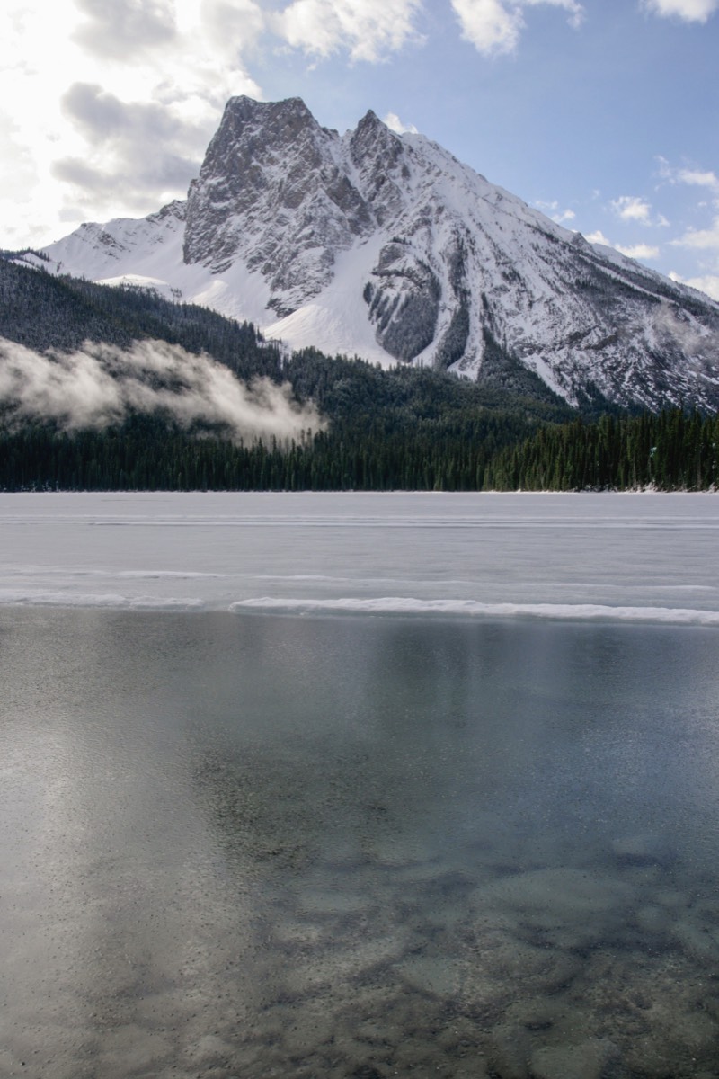 Faint reflection of Mount Burgess in the frozen lake - Yoho NP