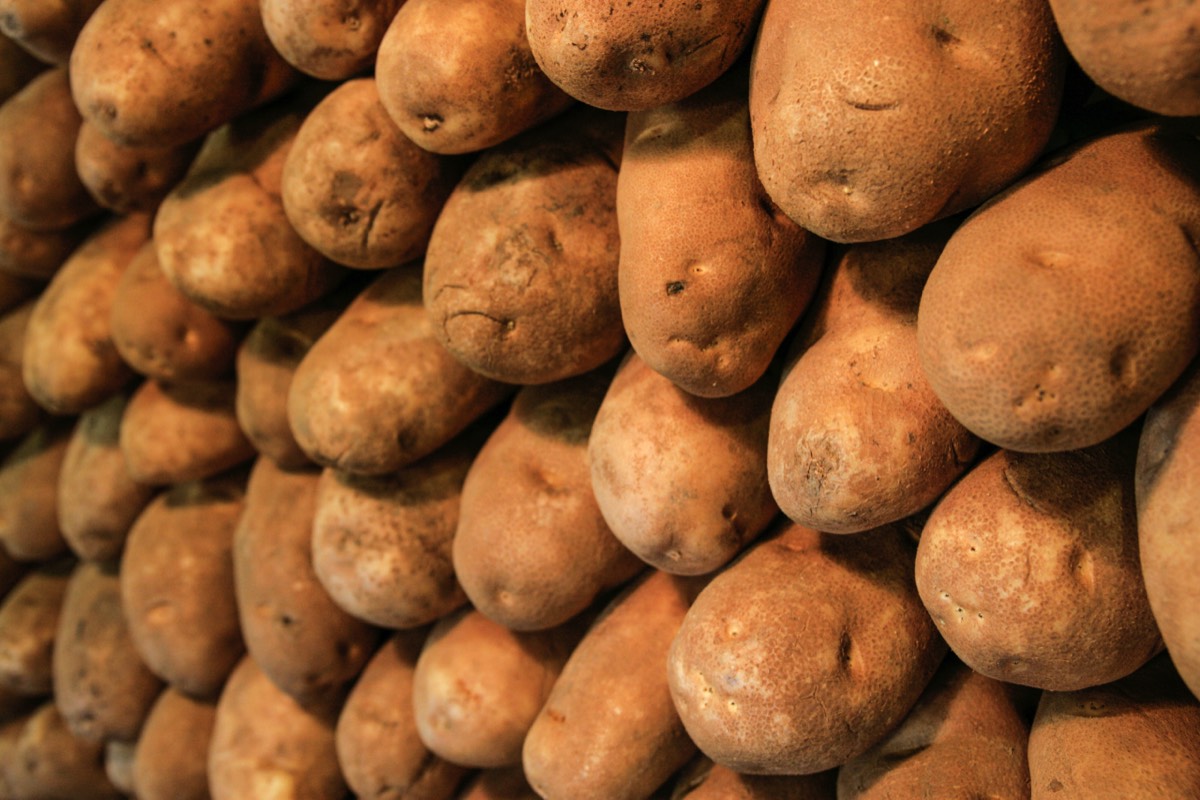 Carefully stacked potatoes in a market - Vancouver