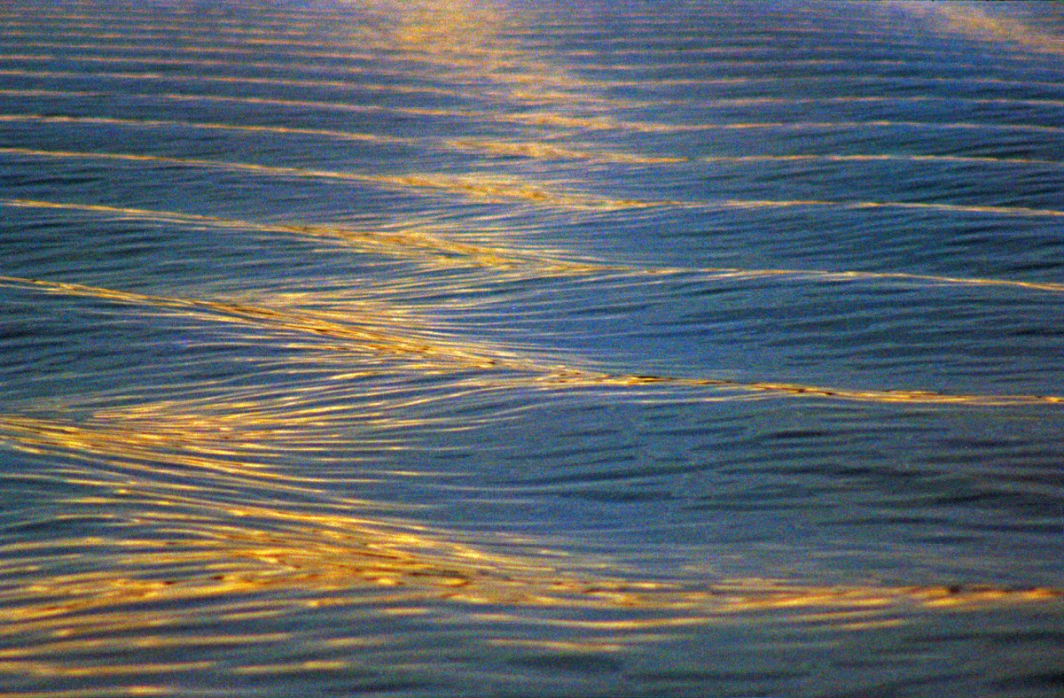 Morning sun on the water of Fiordo Ultima Esperanza