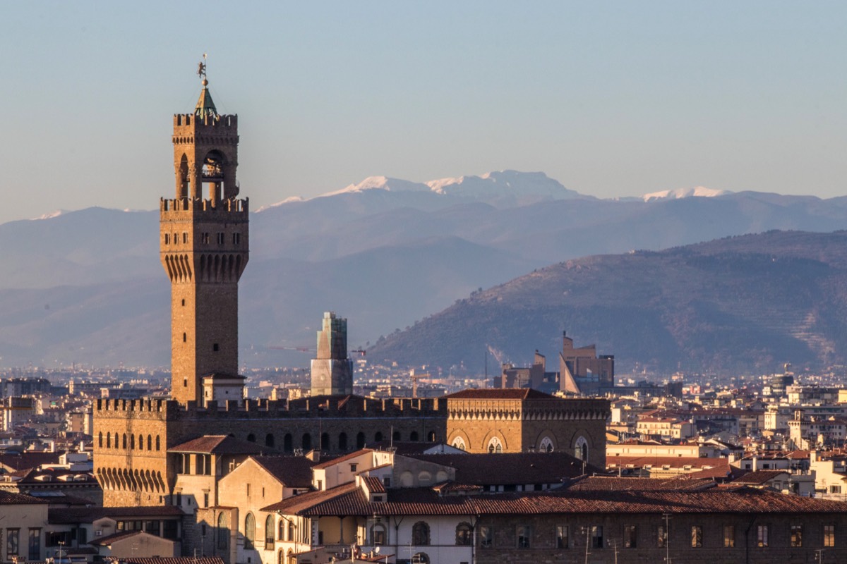 Palazzo Vecchio and snow-covered hills