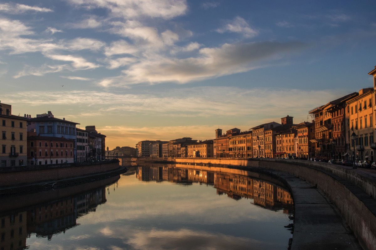 Last rays of the sun on the Arno and Pisa 