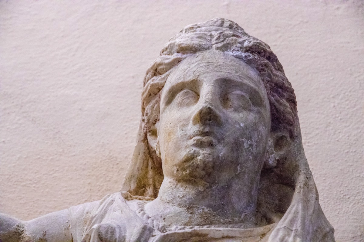 Figure on Etruscan burial urn (Volterra museum)